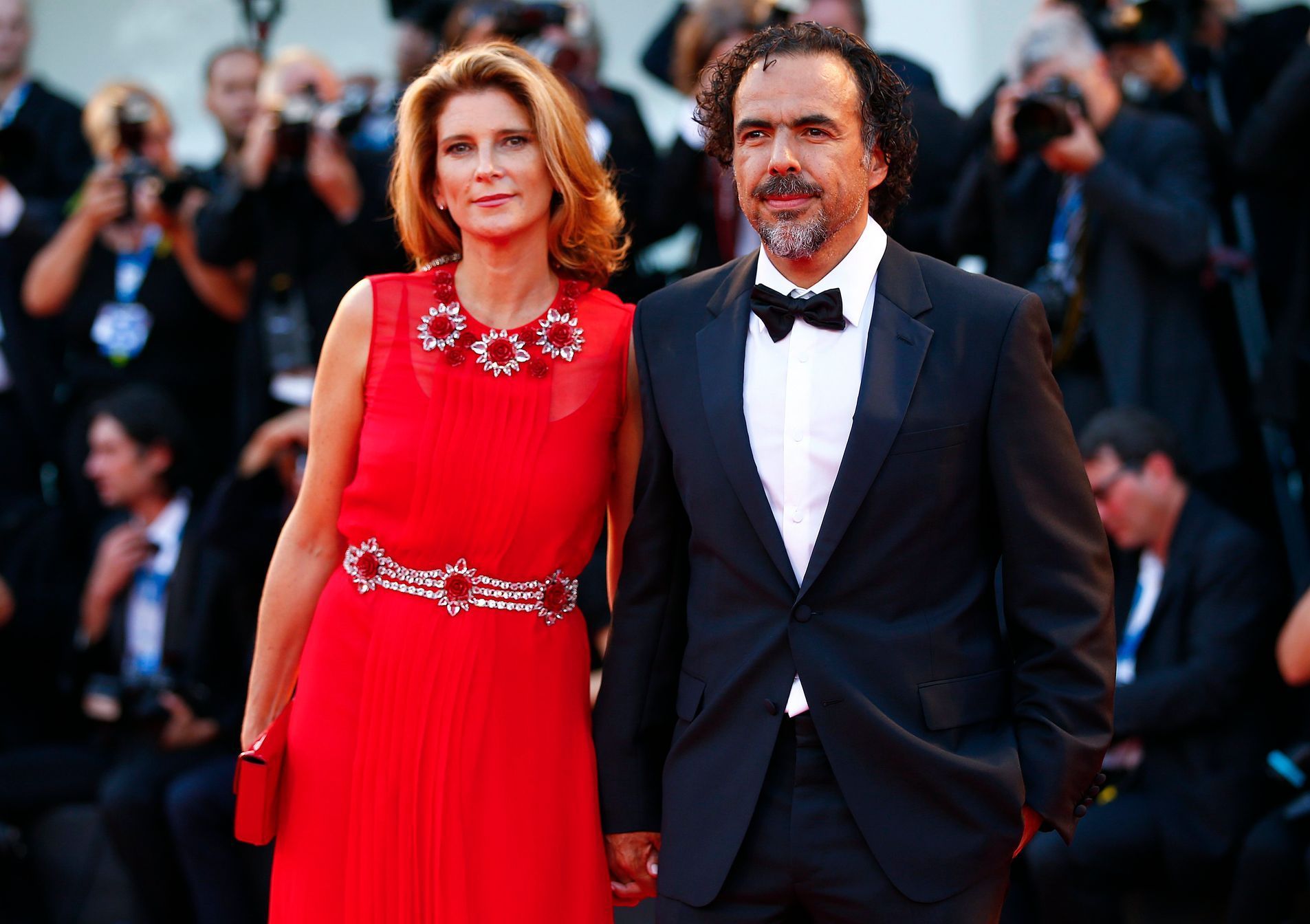 Director Inarritu poses with her wife Hagerman during the red carpet for the movie &quot;Birdman or (The unexpected virtue of ignorance)&quot; at the 71st Venice Film Festival