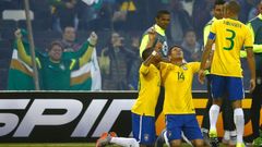 Brazil's Silva celebrates with teammates Robinho and Miranda after scoring a goal against Venezuela during their first round Copa America 2015 soccer match at Estadio Monumental David Arellano in Sant