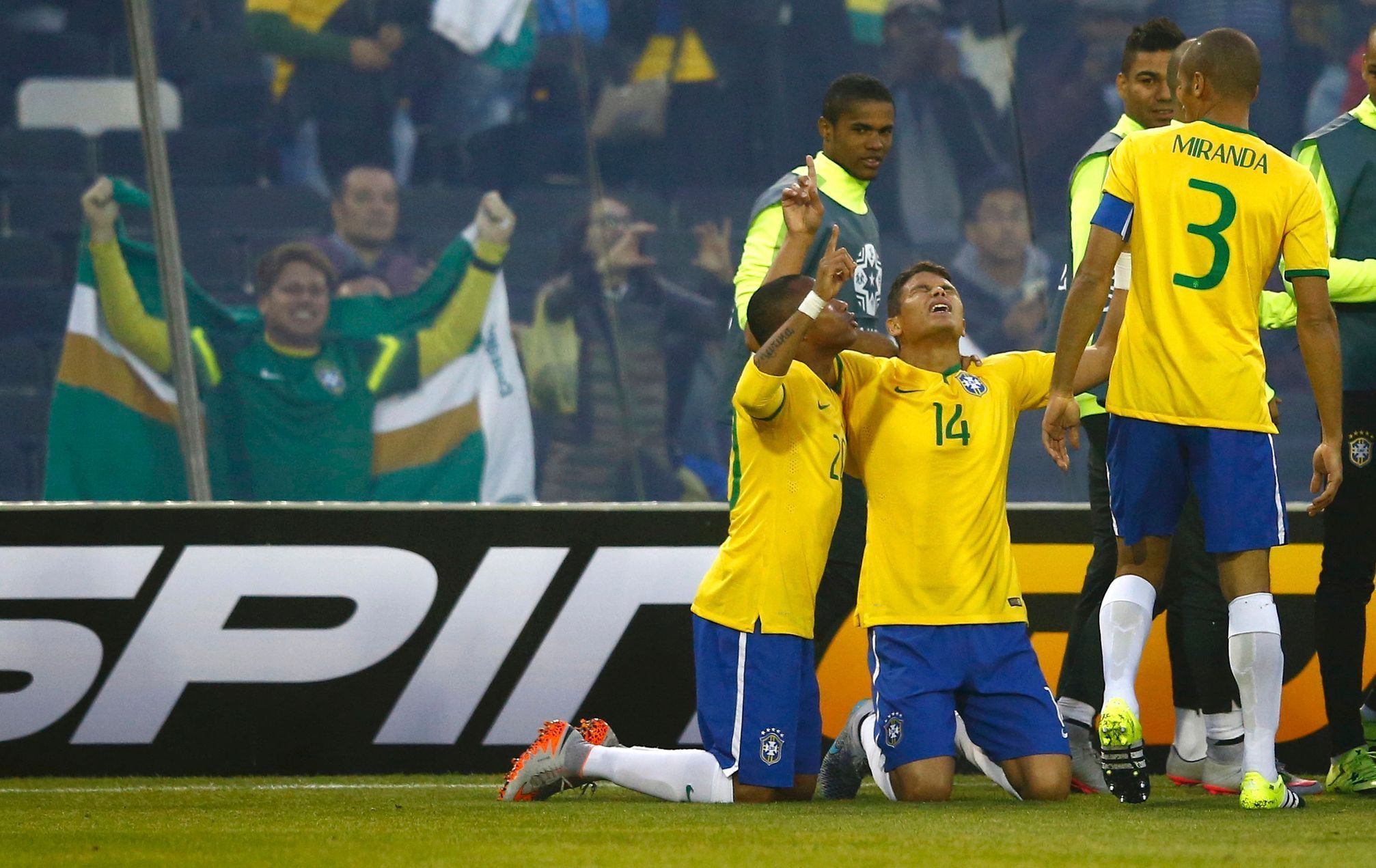 Brazil's Silva celebrates with teammates Robinho and Miranda after scoring a goal against Venezuela during their first round Copa America 2015 soccer match at Estadio Monumental David Arellano in Sant
