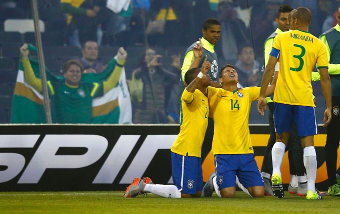 Brazil's Silva celebrates with teammates Robinho and Miranda after scoring a goal against Venezuela during their first round Copa America 2015 soccer match at Estadio Mon