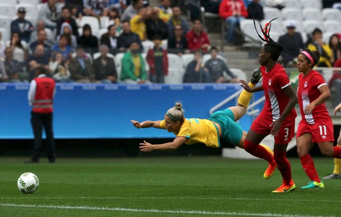 Katrina Gorry (AUS) of Australia with Kadeisha Buchanan (CAN) of Canada and Desiree Scott (CAN) of Canada in action.