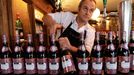 Restaurant owner Christian Lavie, Xurasko opens bottles of French wine Beaujolais Nouveau in Bayonne, southwestern France, Thursday, Nov.15, 2012. Beaujolais Nouveau is a young wine released worldwide on the third Thursday of November every year. (AP Photo/Bob Edme)