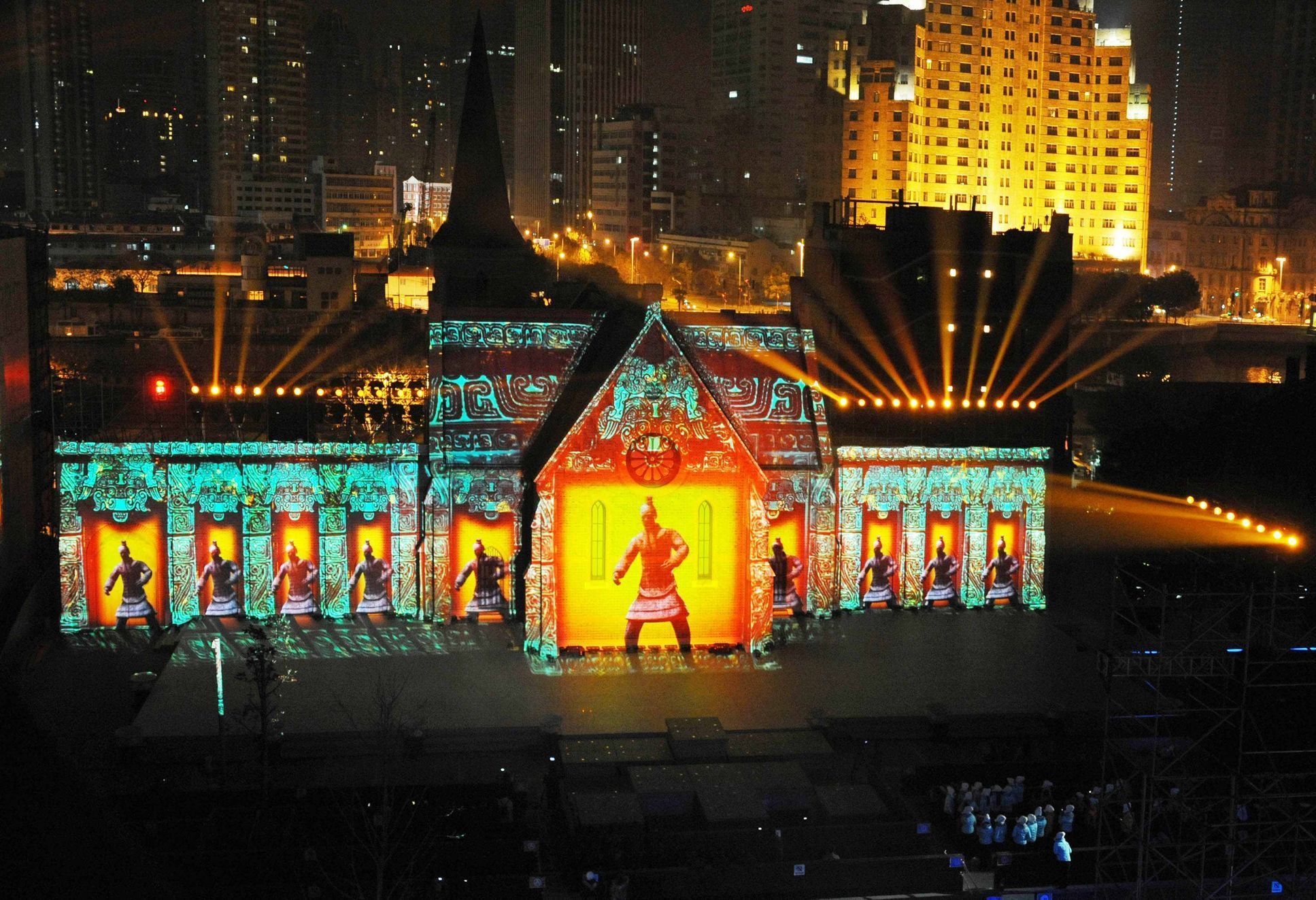 Images of Terra Cotta Warriors are projected on a building during a light show as part of a New Year countdown celebration rehearsal on The Bund in Shanghai