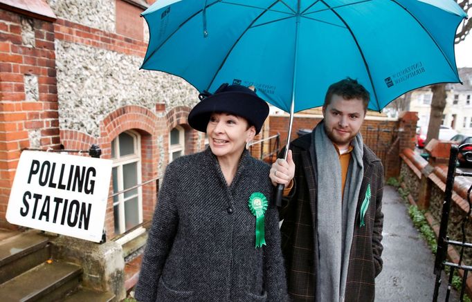 Green Party MP Caroline Lucas leaves a polling station with her son Isaac