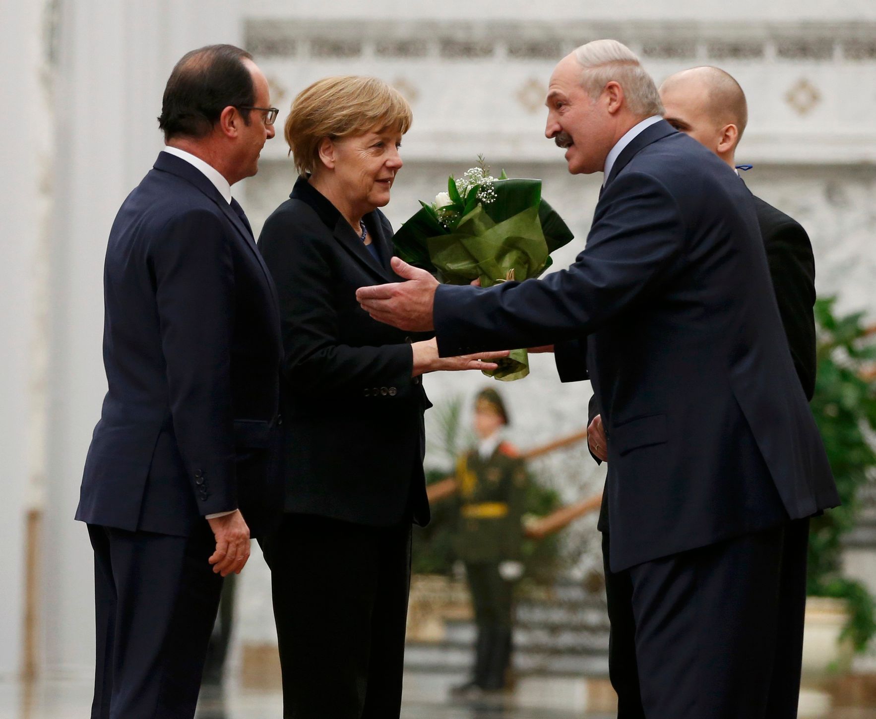 Hollande, Merkelová a Lukašenko