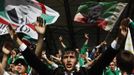 Terek Grozny fans support their team during a soccer match against Amkar Perm at the Akhmad Arena stadium in the Chechen capital Grozny April 27, 2013. The naming of two Chechens, Dzhokhar and Tamerlan Tsarnaev, as suspects in the Boston Marathon bombings has put Chechnya - the former site of a bloody separatist insurgency - back on the world's front pages. Chechnya appears almost miraculously reborn. The streets have been rebuilt. Walls riddled with bullet holes are long gone. New high rise buildings soar into the sky. Spotless playgrounds are packed with children. A giant marble mosque glimmers in the night. Yet, scratch the surface and the miracle is less impressive than it seems. Behind closed doors, people speak of a warped and oppressive place, run by a Kremlin-imposed leader through fear. Picture taken April 27, 2013. REUTERS/Maxim Shemetov (RUSSIA - Tags: SOCIETY POLITICS SPORT) ATTENTION EDITORS: PICTURE 24 OF 40 FOR PACKAGE 'INSIDE MODERN CHECHNYA'. SEARCH 'REBUILDING CHECHNYA' FOR ALL IMAGES Published: Kvě. 1, 2013, 8:04 dop.