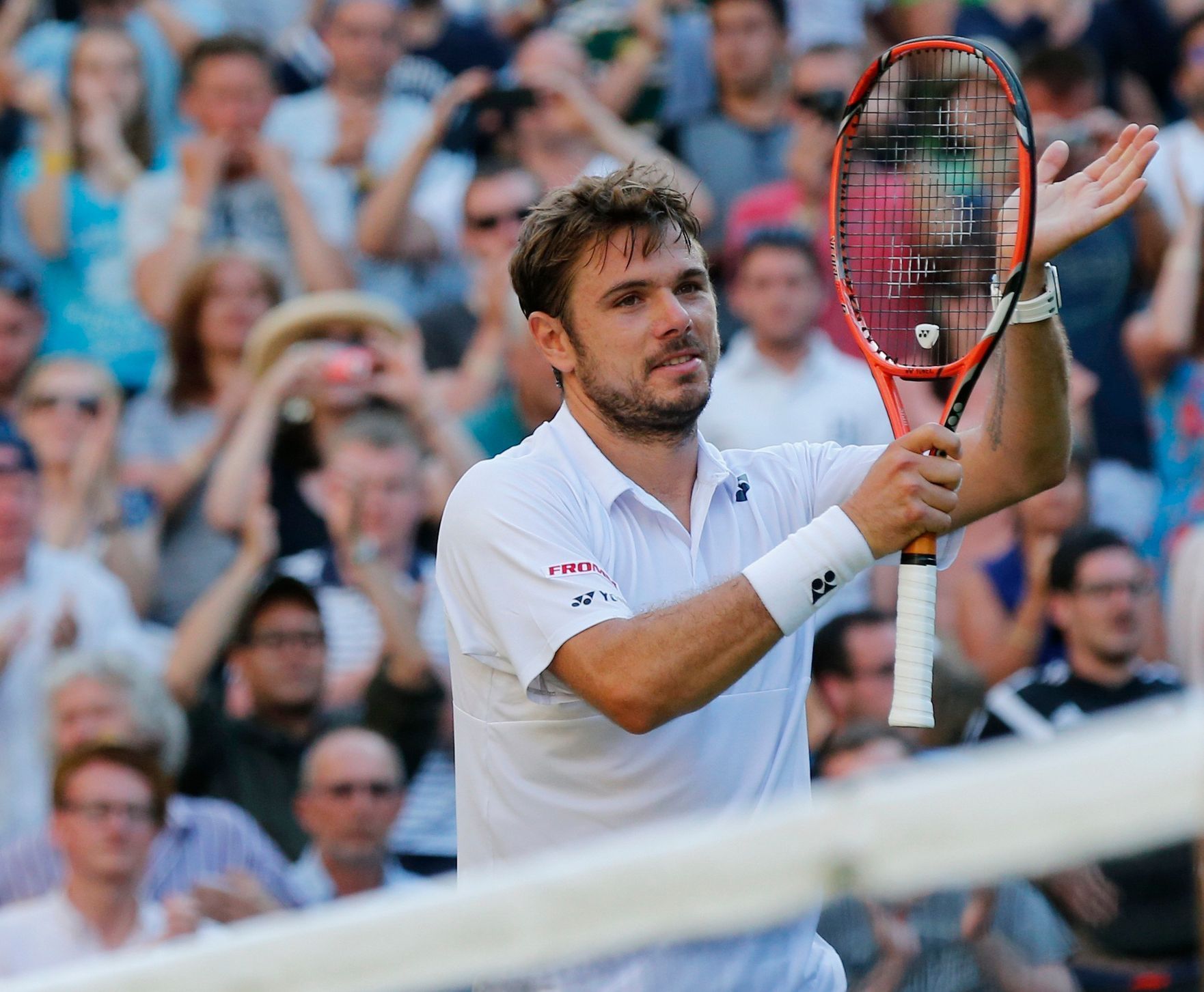 Stan Wawrinka of Switzerland celebrates after winning his match against Joao Sousa of Portugal at the Wimbledon Tennis Championships in London