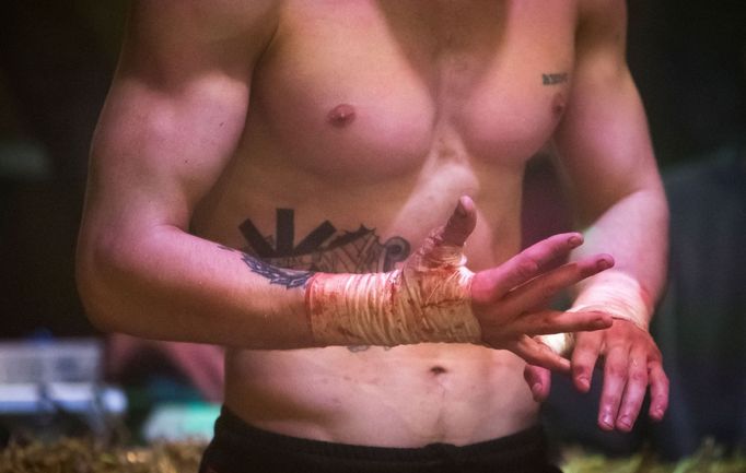 A fighter takes part in the "Top Dog" bare-knuckle boxing tournament in Moscow, Russia April 16, 2021. Picture taken April 16, 2021. REUTERS/Shamil Zhumatov