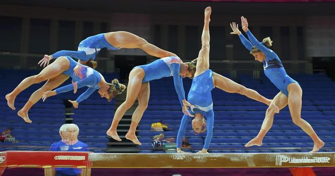 Valeriia Maksiuta of Israel attends a gymnastics training session at the O2 Arena before the start of the London 2012 Olympic Games July 26, 2012. This picture was taken using multiple exposures. REUTERS/Brian Snyder (BRITAIN - Tags: SPORT OLYMPICS SPORT GYMNASTICS) Published: Čec. 26, 2012, 12:22 odp.