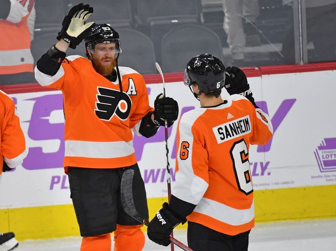 Nov 25, 2019; Philadelphia, PA, USA; Philadelphia Flyers right wing Jakub Voráček (93) celebrates win with Philadelphia Flyers defenseman Travis Sanheim (6) against the d