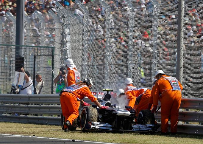 Williams Formula One driver Valtteri Bottas of Finland is pushed out of the track by marshals after failing to complete in the Hungarian F1 Grand Prix at the Hungaroring