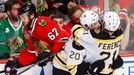 Boston Bruins' Daniel Paille (C) celebrates his overtime winning goal with teammate Andrew Ference as Chicago Blackhawks' Michael Frolik skates away during overtime in Ga