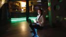 Daria Vitasovic, a 27 year-old bar manager, poses for a picture as she works on her laptop in a night bar in Zagreb, May 8, 2012. Vitasovic studied for seven years at Society of Jesus University where she received a degree in philosophy and religious sciences. She hoped to find a job in teaching or study for a PhD in philosophy but has been working as a bar manager for the past four years.