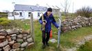 Artist and poet Barry Edgar Pilcher leaves his cottage on the Island of Inishfree in County Donegal to play his saxaphone on the beach, May 1, 2012. REUTERS/Cathal McNaughton