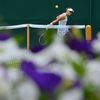 Samantha Stosur of Australia hits a return to Olga Puchkova