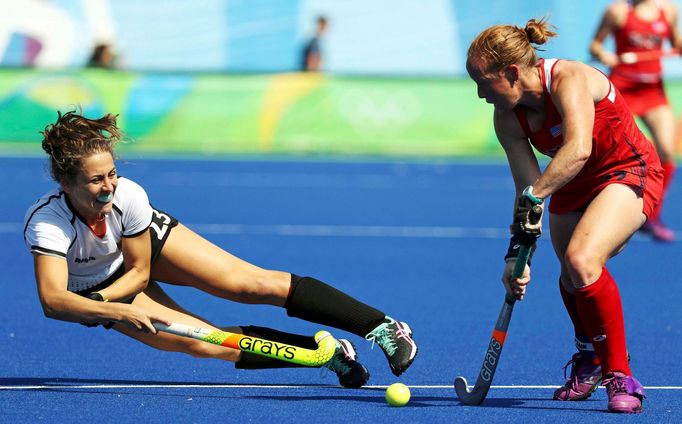 Women's Quarterfinal Match USA v Germany - Olympic Hockey Centre - Rio de Janeiro, Brazil - 15/08/2016. Marie Mavers (GER) of Germany (L) competes with Lauren Crandall (U