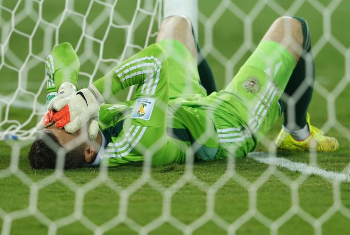 Russia's goalkeeper Igor Akinfeev reacts to conceding a goal to South Korea's Lee Keun-ho (not pictured) during their 2014 World Cup Group H soccer match against South Ko