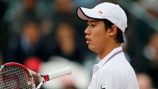 Kei Nishikori of Japan reacts during his men's singles match against Martin Klizan of Slovakia at the French Open tennis tournament at the Roland Garros stadium in Paris