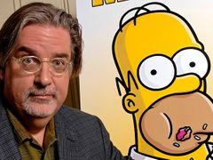 Matt Groening with his brainchild Homer Simpson peeping in