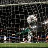 Chelsea goalkeeper Cech fails to catch the ball as Paris St Germain's Lavezzi scored the first goal for the team during their Champions League quarter-final first leg soccer match against Chelsea at t