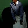 A Line judge casts a shadow at the Wimbledon Tennis Championships in London