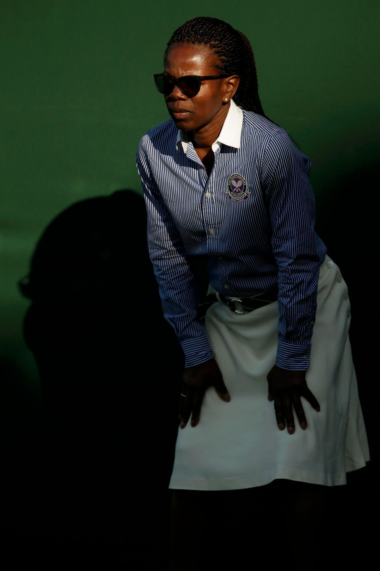 A Line judge casts a shadow at the Wimbledon Tennis Championships in London