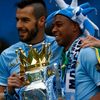 Manchester City's Alvaro Negredo and team mate Fernandinho celebrate after winning the English Premier League trophy