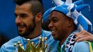 Manchester City's Alvaro Negredo and team mate Fernandinho celebrate after winning the English Premier League trophy