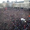 A general view shows an ambulance surrounded by hundreds of thousands of people gathering on the Place de la Republique to attend the solidarity march in the streets of Paris