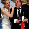 Actress Uma Thurman and actor Timothy Spall, Best Actor award winner for his role in the film &quot;Mr. Turner&quot;, pose on stage during the closing ceremony of the 67th Cannes Film Festival in Cann
