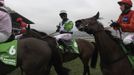 Noel Fehily (C), riding on Rock on Ruby, celebrates after winning the Champion Hurdle Challenge Trophy at the Cheltenham Festival horse racing meet in Gloucestershire, western England March 13, 2012.