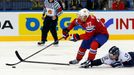 Norway's Martin Roymark (C) is chased by Slovakia's Ivan Svarny (R) during the second period of their men's ice hockey World Championship group A game at Chizhovka Arena