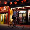 Man cycles through Chinatown in Los Angeles, California