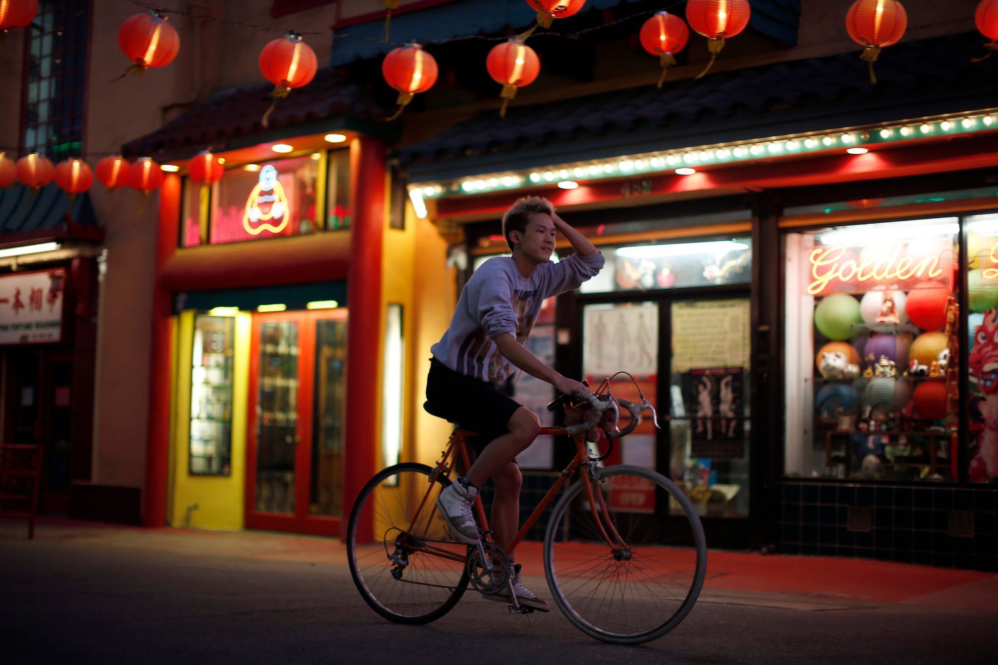 Man cycles through Chinatown in Los Angeles, California