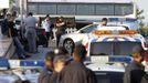 Police officers stand outside Bulgaria's Burgas airport July 18, 2012. Three people were killed and over 20 injured by an explosion on a bus carrying Israeli tourists outside the airport of the Black Sea city of Burgas on Wednesday. The mayor of the city, on Bulgaria's Black Sea coast, said the bus was carrying Israeli tourists, but the police could not immediately confirm the nationality of the tourists. Police said several other buses at the site had been damaged. REUTERS/Stringer (BULGARIA - Tags: DISASTER)