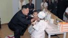 North Korean leader Kim Jong-Un (front L) visits Kyongsang Kindergarten in this undated picture released by the North's KCNA in Pyongyang July 15, 2012. REUTERS/KCNA (NORTH KOREA - Tags: POLITICS TPX IMAGES OF THE DAY) THIS IMAGE HAS BEEN SUPPLIED BY A THIRD PARTY. IT IS DISTRIBUTED, EXACTLY AS RECEIVED BY REUTERS, AS A SERVICE TO CLIENTS. NO THIRD PARTY SALES. NOT FOR USE BY REUTERS THIRD PARTY DISTRIBUTORS Published: Čec. 15, 2012, 10:07 dop.