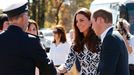 Catherine, the Duchess of Cambridge, greets officials as she arrives with her husband Britain's Prince William to meet with families that lost their homes during bushfire