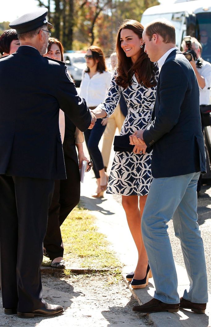 Catherine, the Duchess of Cambridge, greets officials as she arrives with her husband Britain's Prince William to meet with families that lost their homes during bushfire