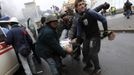 nti-government protesters carry an injured man on a stretcher in Independence Square in Kiev February 20, 2014. Ukrainian anti-government protesters on Thursday seized ba