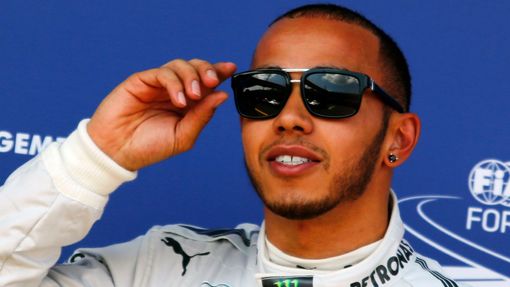 Mercedes Formula One driver Lewis Hamilton of Britain reacts after taking the pole position in the qualifying session of the German F1 Grand Prix at the Nuerburgring raci