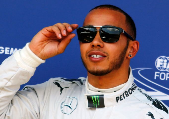 Mercedes Formula One driver Lewis Hamilton of Britain reacts after taking the pole position in the qualifying session of the German F1 Grand Prix at the Nuerburgring raci