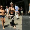 Women arrive to take part in a topless march in New York