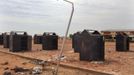 Storage lockers at a fish market used as a military base by al Qaeda-linked militants are seen in Konna, Mali, January 27, 2013. French airstrikes destroyed tanks and other armoured vehicles at the market last week. REUTERS/Joe Penney (MALI - Tags: POLITICS MILITARY CONFLICT) Published: Led. 27, 2013, 4:48 odp.