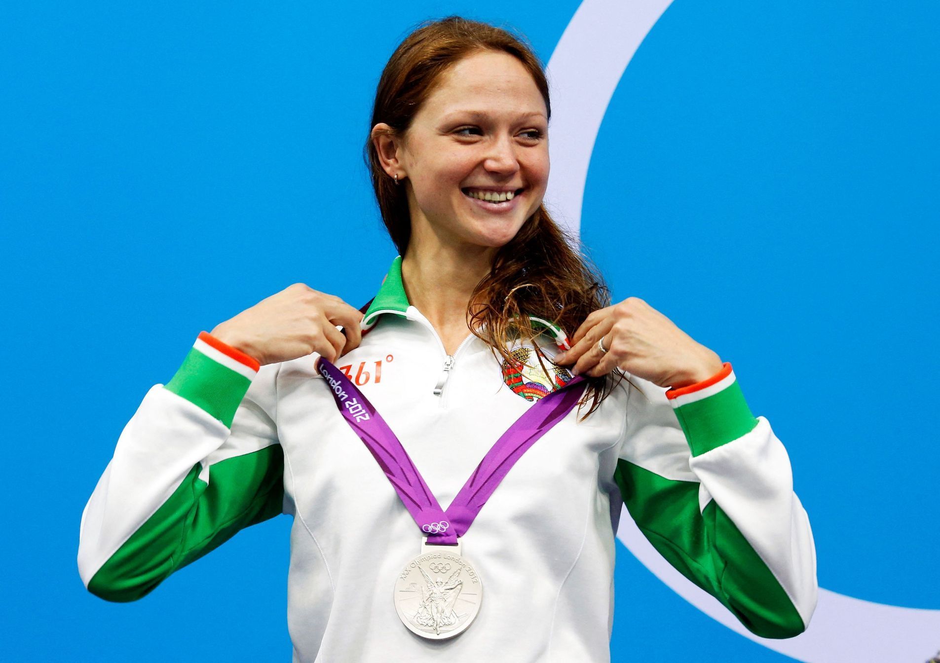 FILE PHOTO: Belarus' Aliaksandra Herasimenia smiles with her silver medal during the women's 100m freestyle victory ceremony during the London 2012 Olympic Games at the Aquatics Centre