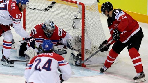 Canada's Jordan Eberle (R) wraps around a goal past goaltender Ondrej Pavelec of the Czech Republic (C) during their Ice Hockey World Championship game against Sweden at