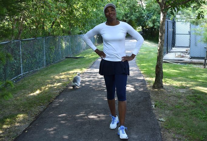 Aug 2, 2019; Toronto, Ontario, Canada; Venus Williams (USA) walks with her pet Havanese dog Harold as she prepares to practice before the start of the Rogers Cup at the A