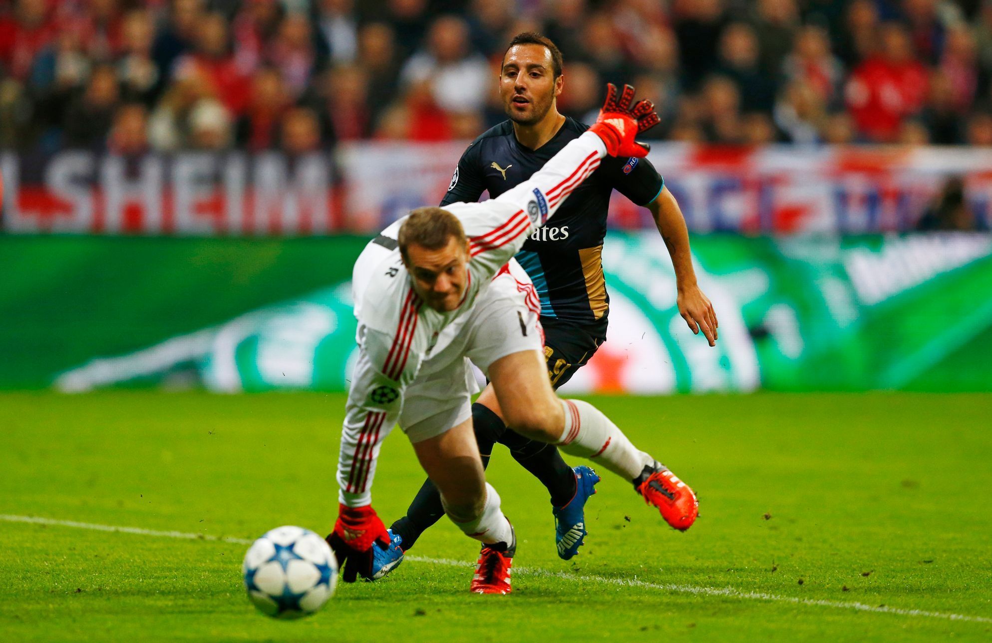 Arsenal's Santi Cazorla in action with Bayern Munich's Manuel Neuer