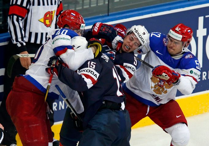 Russia's Sergei Kalinin (L) and Sergei Shirokov (R) scuffle with Craig Smith (15) and Tyler Johnson (9) of the U.S. during the second period of their men's ice hockey Wor