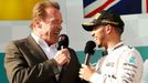 Race winner Mercedes Formula One driver Lewis Hamilton of Britain (R) and actor Arnold Schwarzenegger speak during the podium ceremony of the Australian F1 Grand Prix at