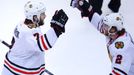 Chicago Blackhawks' Brent Seabrook (L) celebrates his game-winning goal against the Boston Bruins with teammate Duncan Keith during overtime in Game 4 of their NHL Stanle